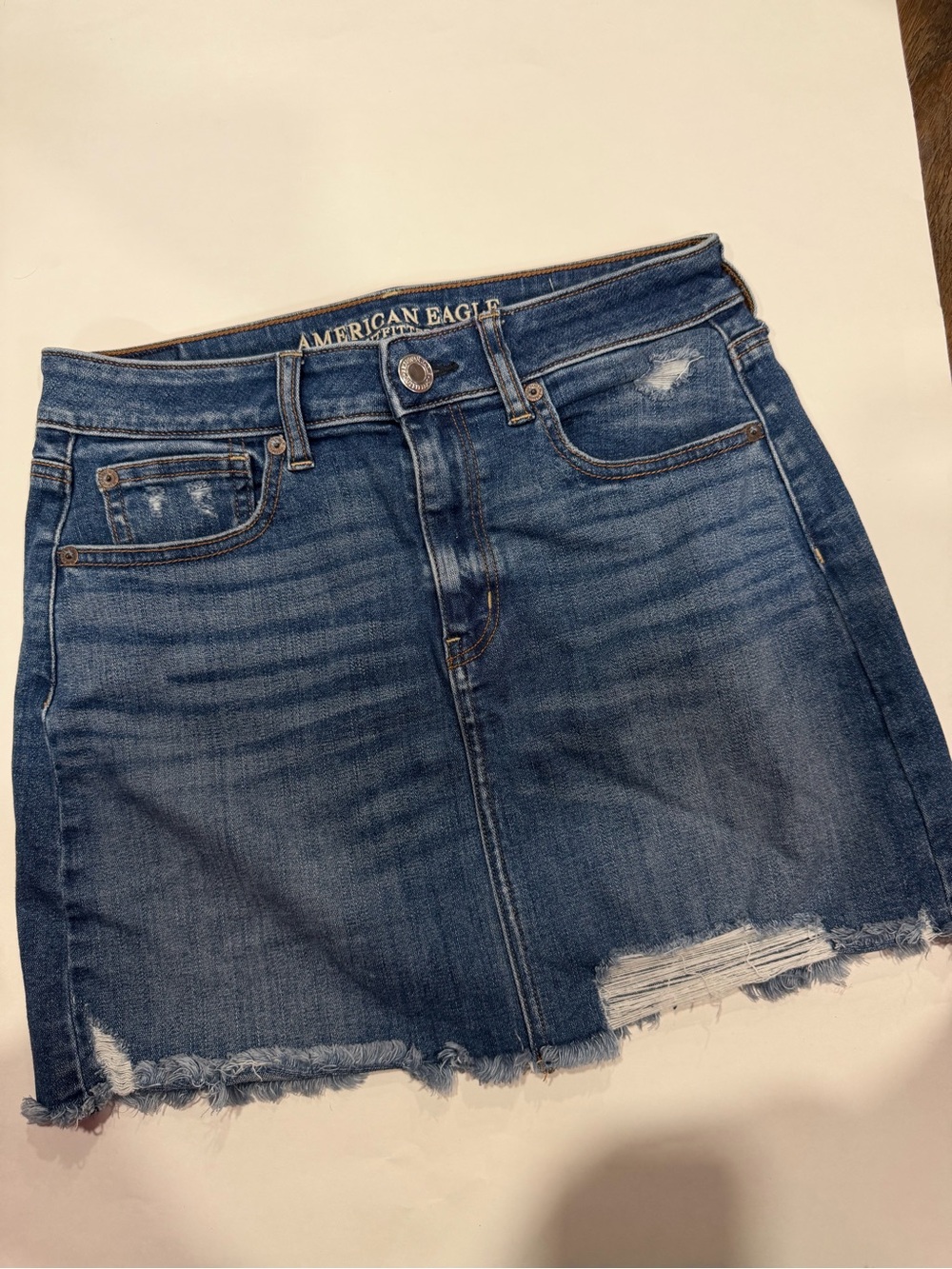 American Eagle Outfitters distressed blue denim mini skirt